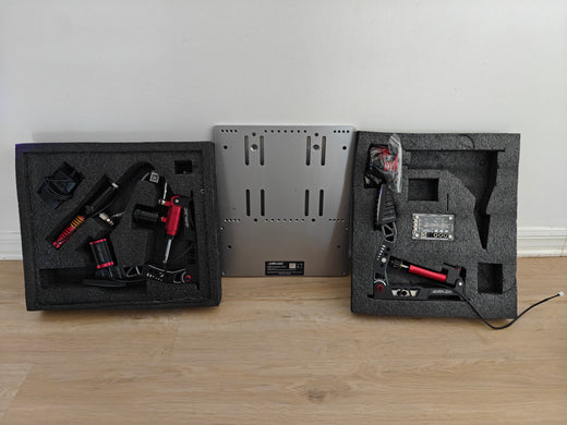 Used Simagic P2000 two-pedal set with baseplate, controller, accessories, and two haptic motors